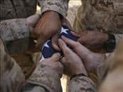 Military Marines-Fold-an-American-Flag-after-It-was-Raised-i